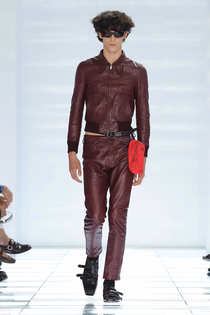 Prada Spring/Summer 2027 menswear burgundy leather look with red waist pouch