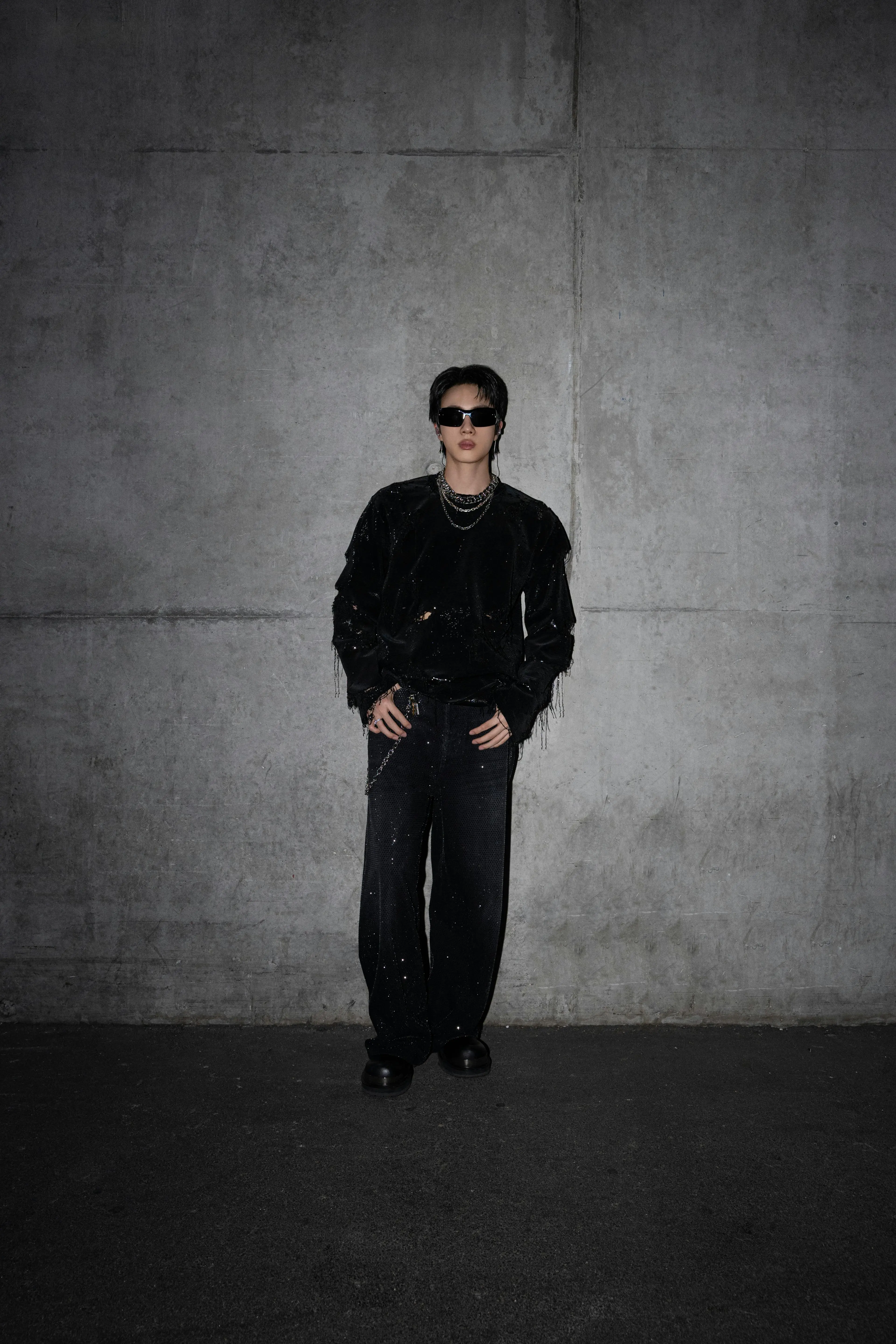 BTS ARIRANG: Inside the Looks of the World Tour Vanity Teen 虚荣青年 Jin of BTS wearing a black Gucci sequin-embroidered top with crystal-embellished denim trousers during the ARIRANG World Tour in Paris.
