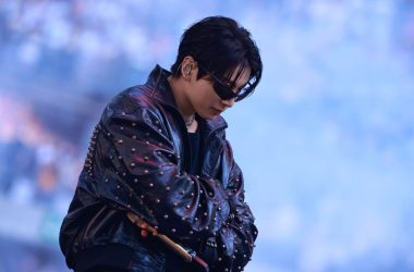 Jung Kook of BTS wearing a custom black leather Balenciaga look during the ARIRANG World Tour in Paris.