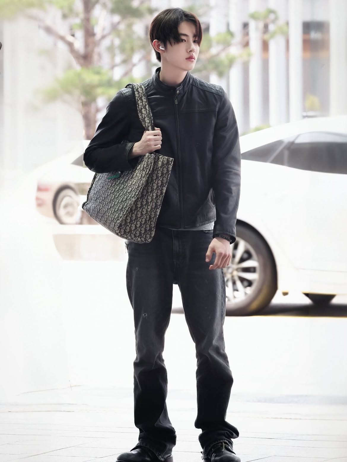 Seonghyeon of CORTIS carrying a Point of Time bag at Incheon International Airport