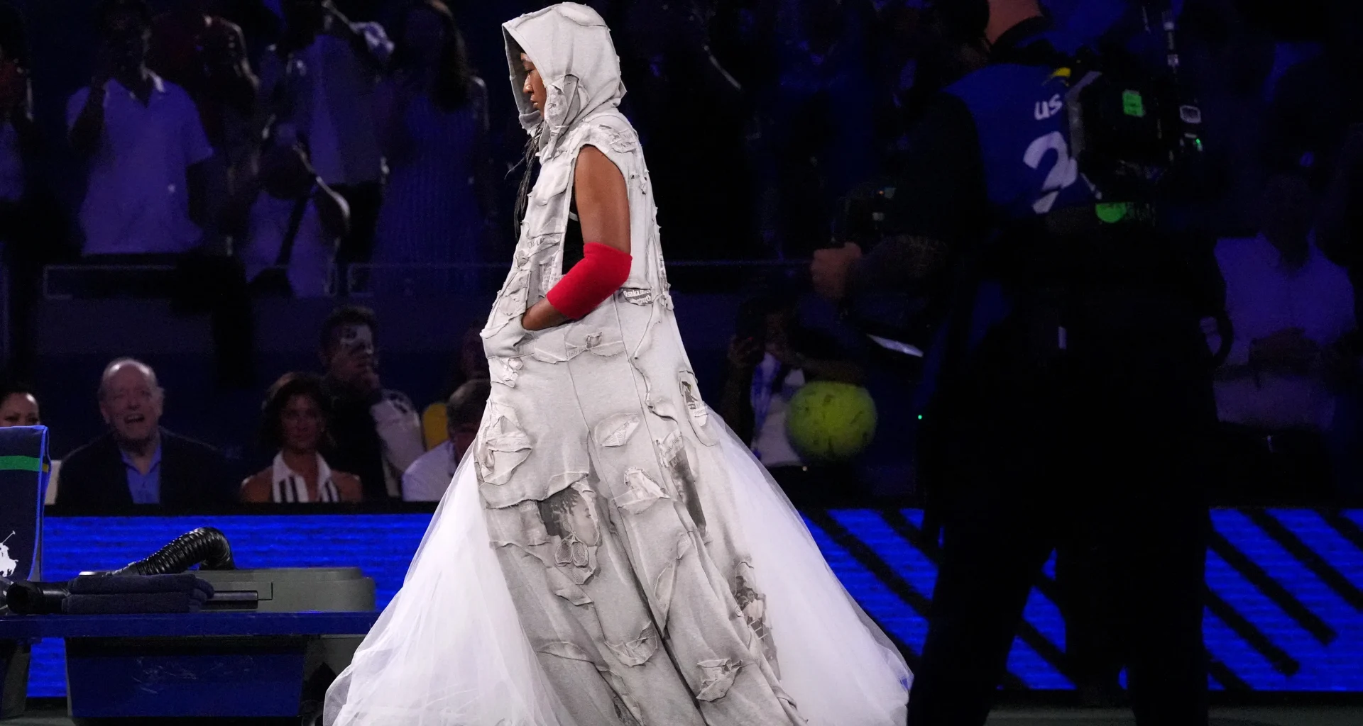 Naomi Osaka walks onto Arthur Ashe Stadium in a custom Who Decides War look