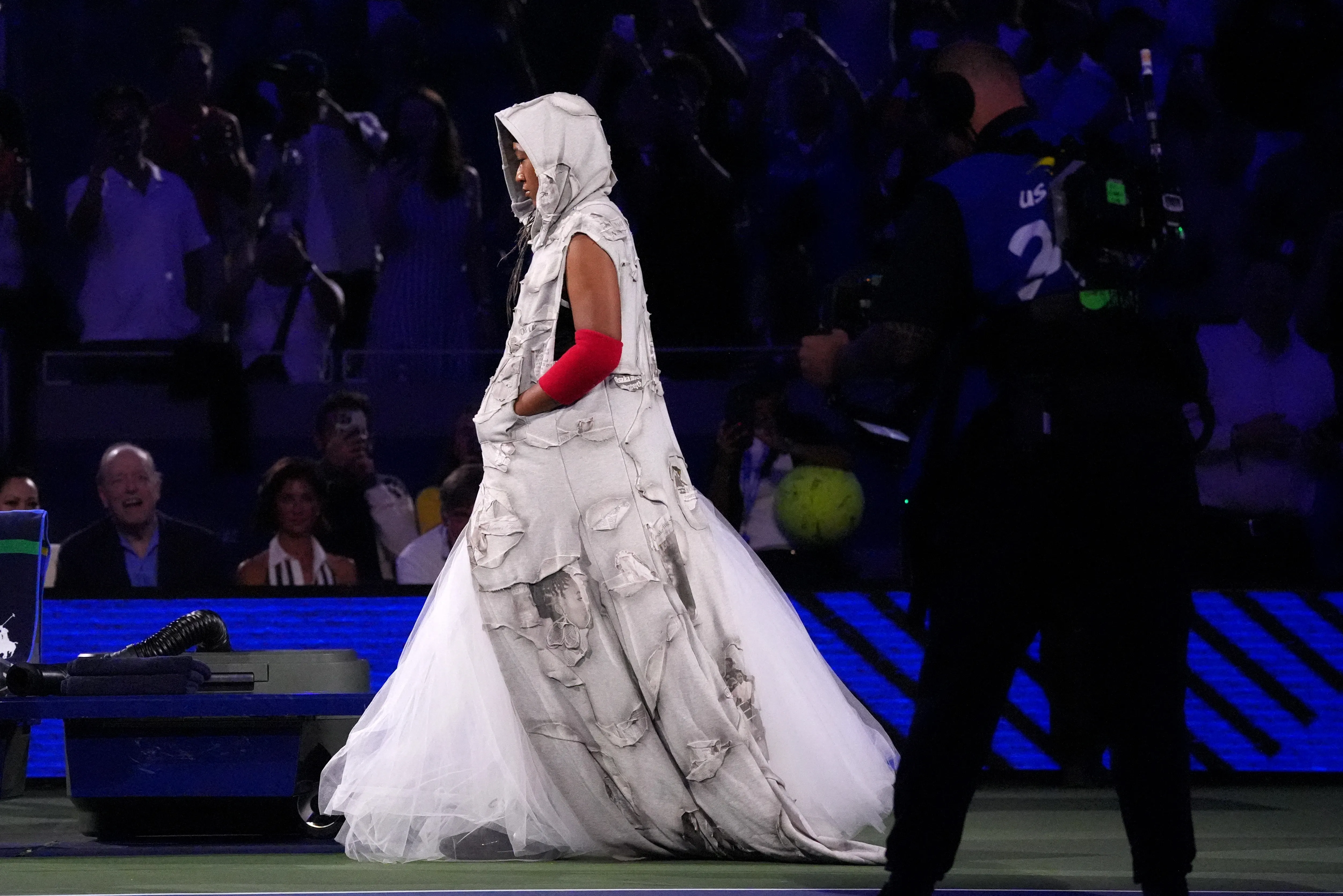 Naomi Osaka walks onto Arthur Ashe Stadium in a custom Who Decides War look