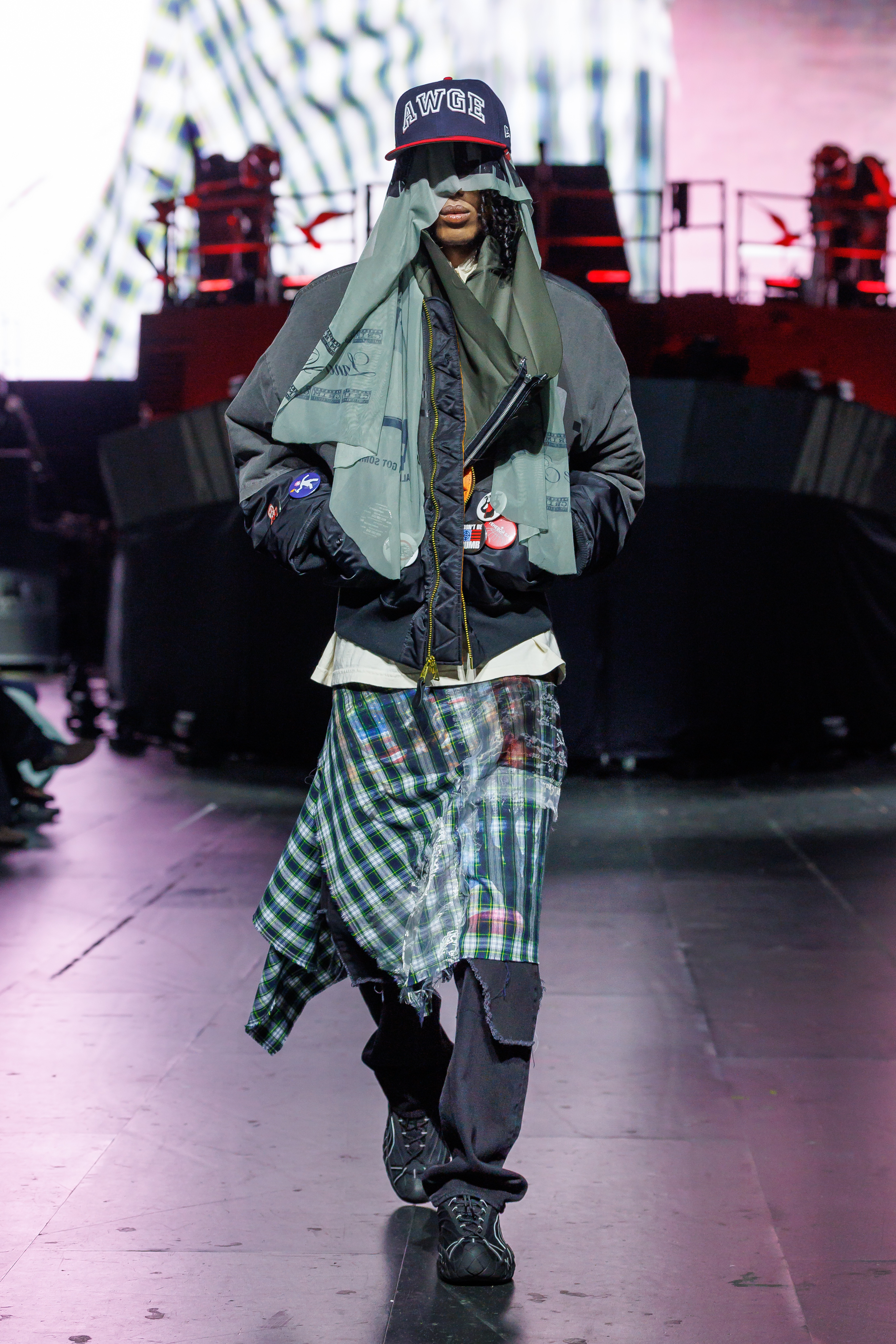 AWGE Turns the Warship Into a Daring Runway for Spring Summer 2027 Vanity Teen A$AP Rocky's AWGE / Anti-War Global Economics brings military codes, concert dressing, luxury and streetwear together for a collection that stays deliberately caught between seriousness and spectacle.