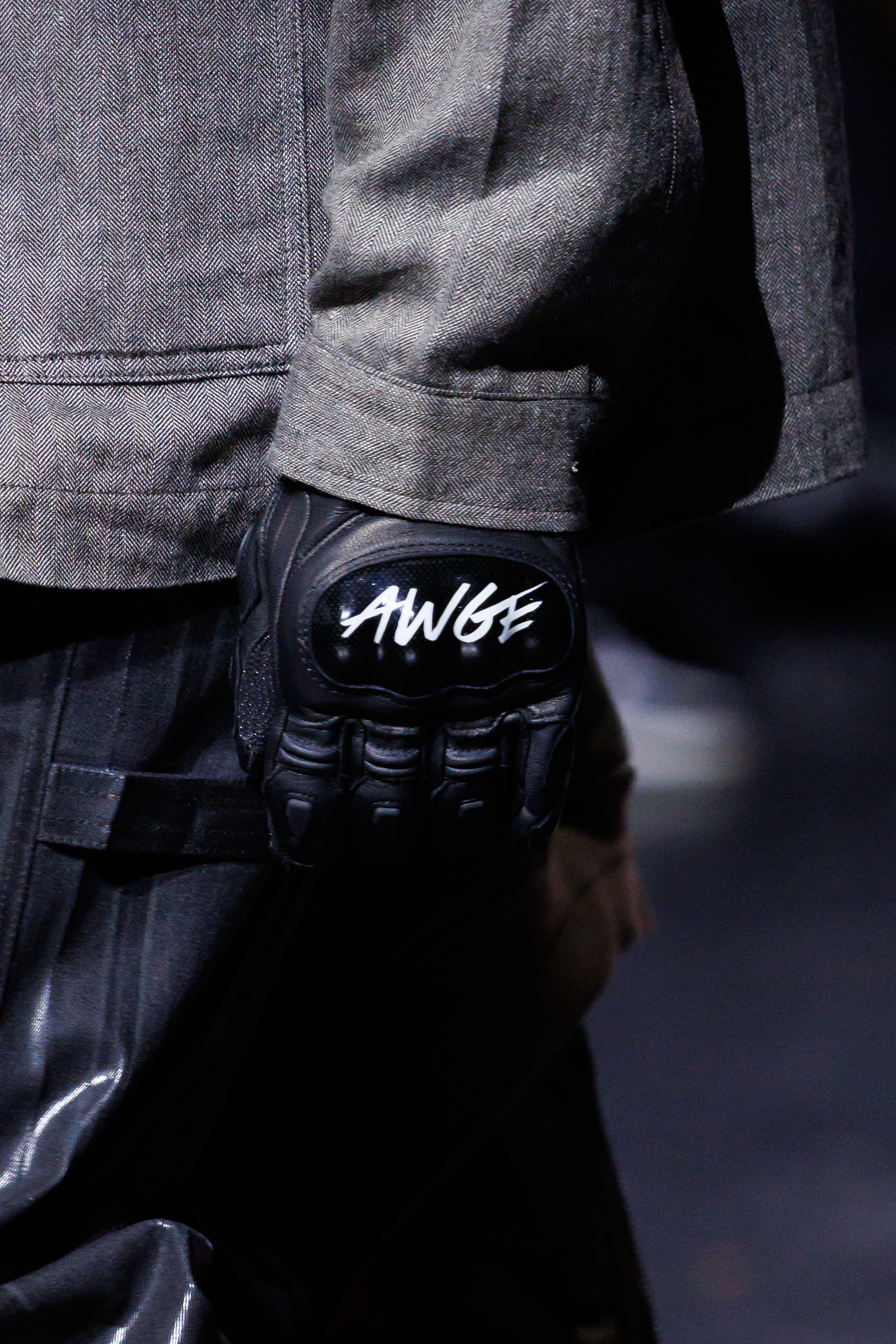 AWGE Turns the Warship Into a Daring Runway for Spring Summer 2027 Vanity Teen A$AP Rocky's AWGE / Anti-War Global Economics brings military codes, concert dressing, luxury and streetwear together for a collection that stays deliberately caught between seriousness and spectacle.