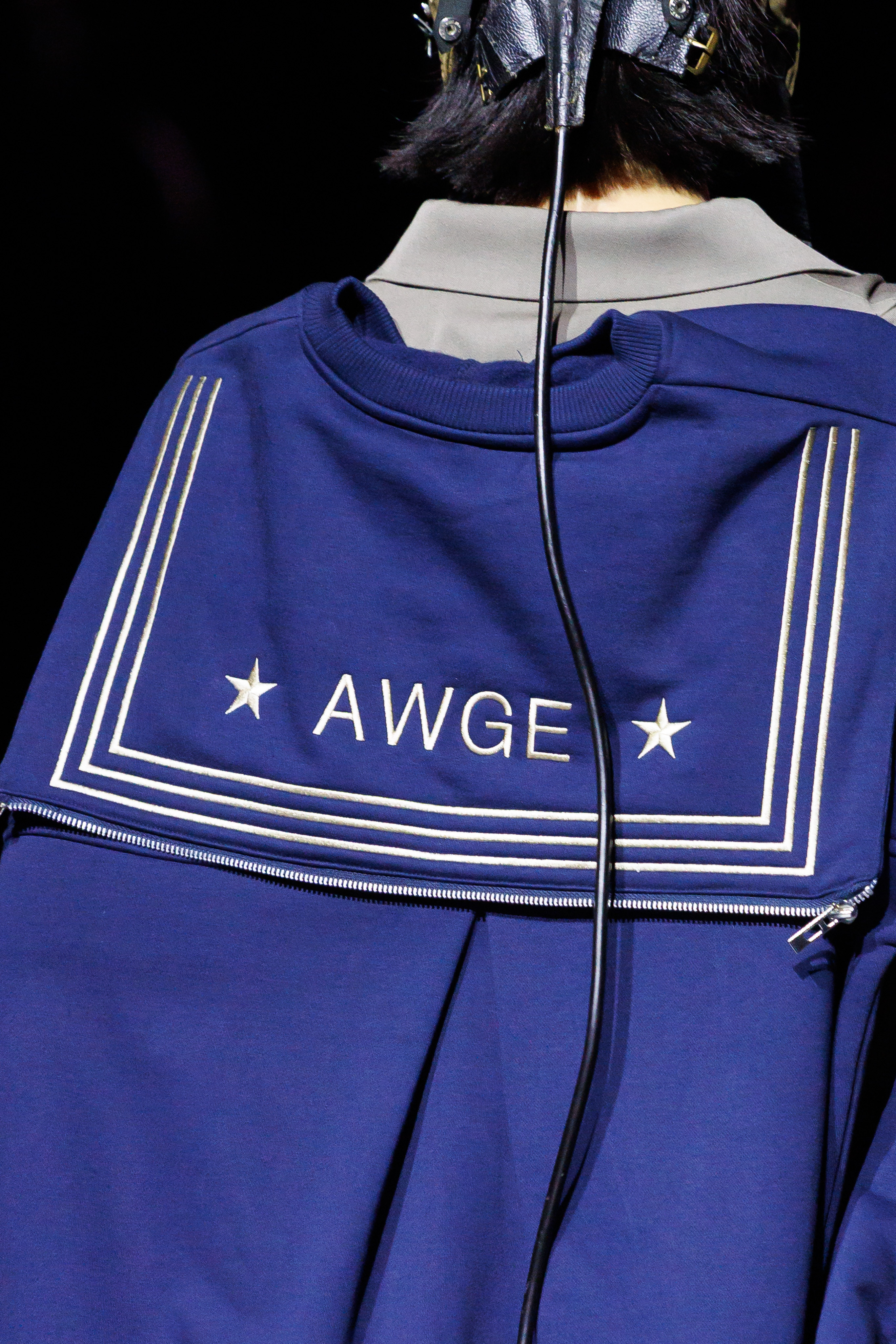 AWGE Turns the Warship Into a Daring Runway for Spring Summer 2027 Vanity Teen A$AP Rocky's AWGE / Anti-War Global Economics brings military codes, concert dressing, luxury and streetwear together for a collection that stays deliberately caught between seriousness and spectacle.