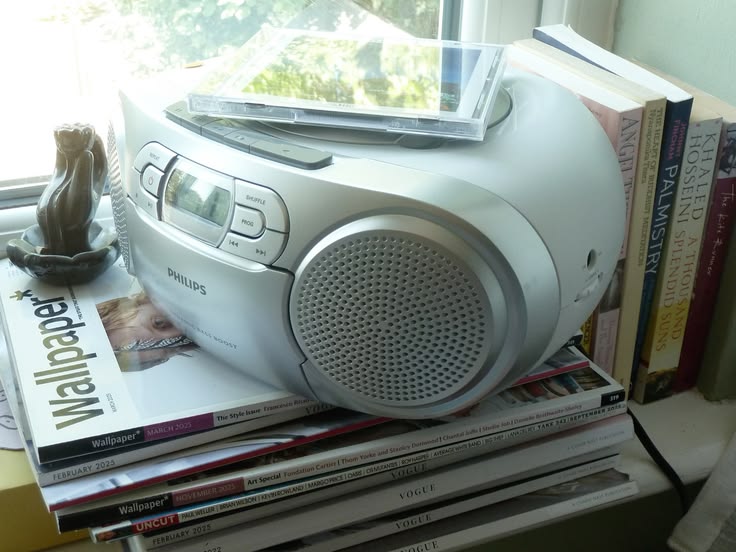 Is the CD the New Vinyl? Inside the Y2K Physical Renaissance Vanity Teen Is the CD the New Vinyl? Vintage Y2K aesthetic, Philips CD boombox playing a compact disc.
